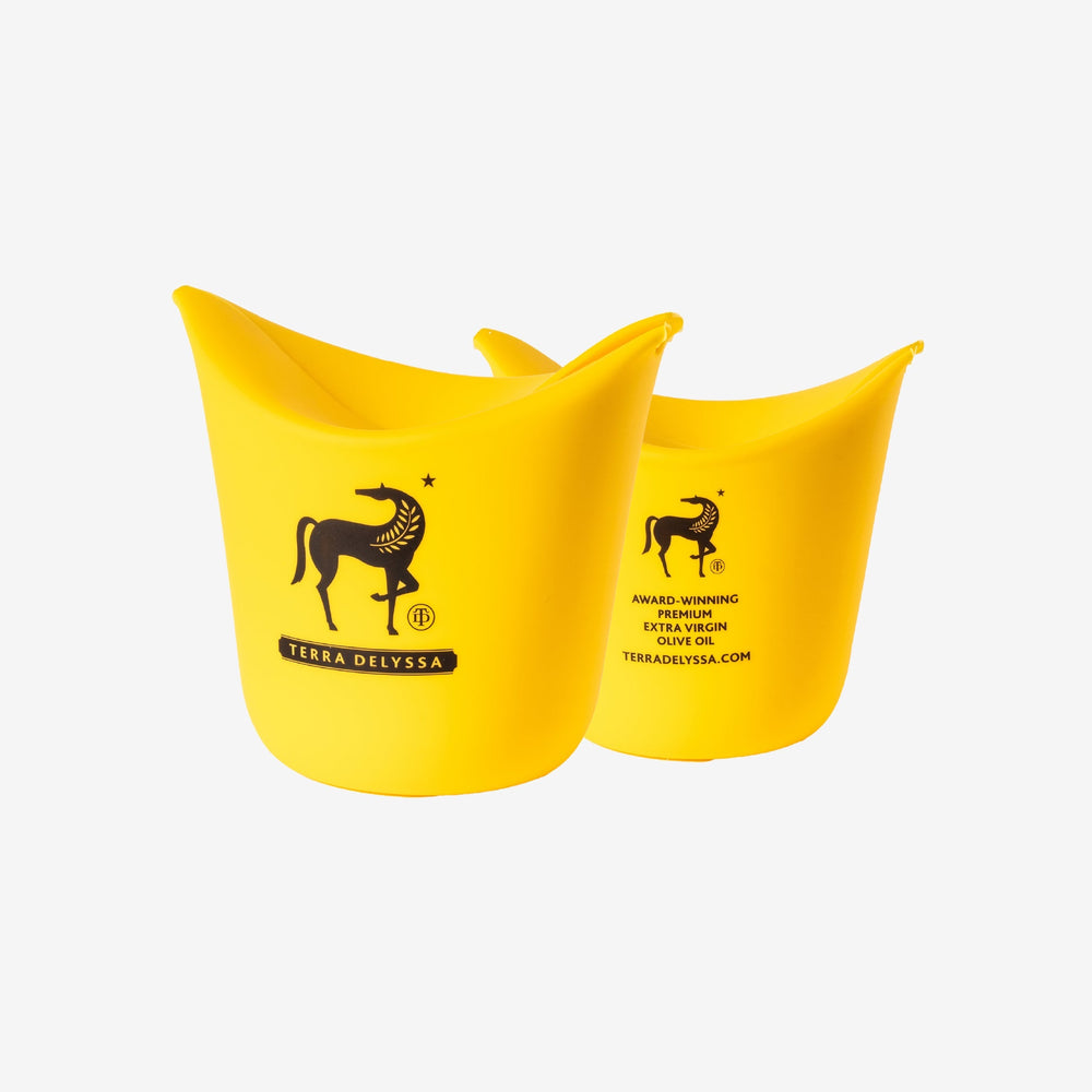 
                  
                    Front and back view of the yellow Terra Delyssa single-serve silicone popcorn popper featuring the iconic horse logo, showcasing its compact and foldable design.
                  
                